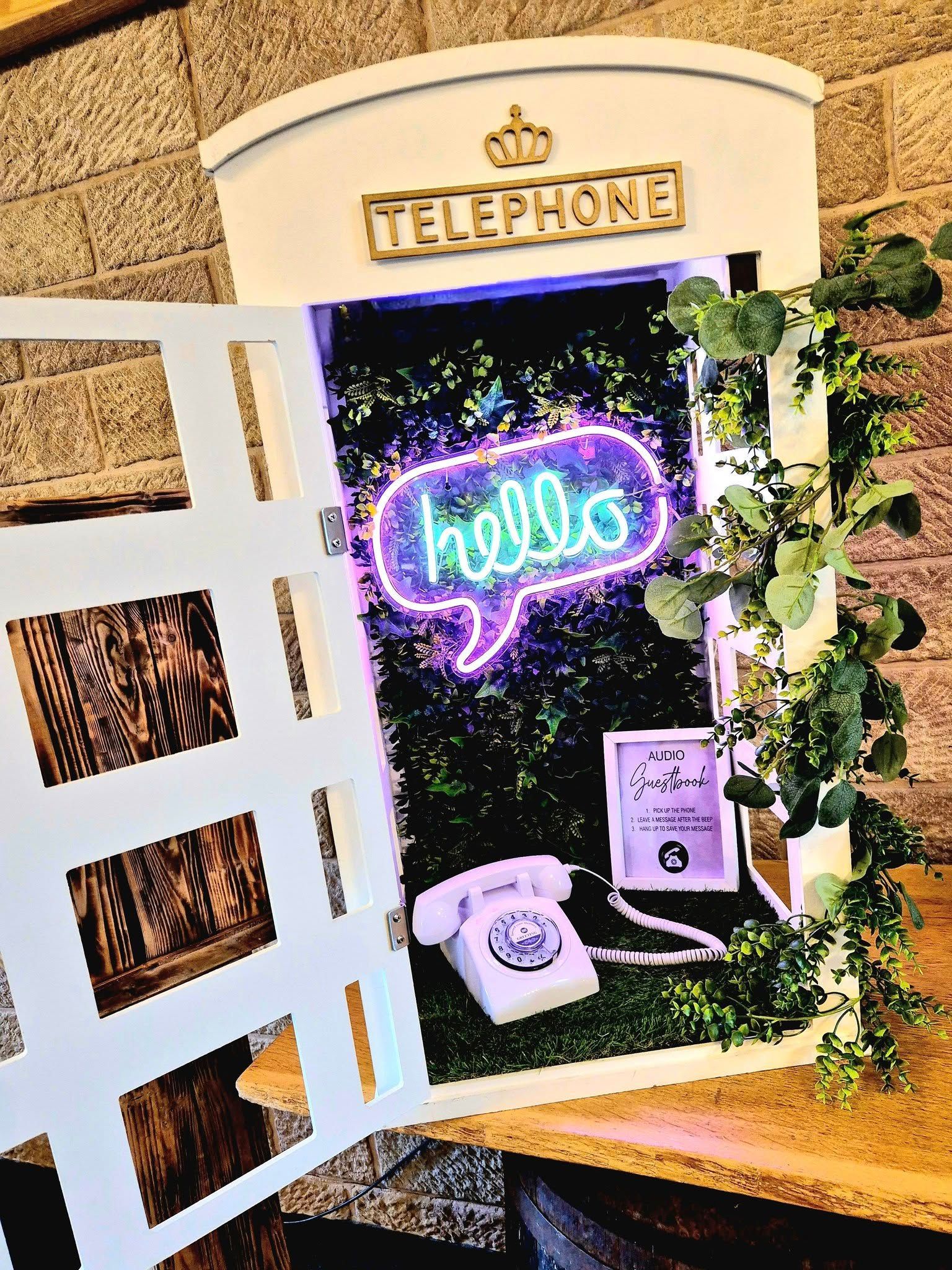 Audio guestbook phone booth with hello neon signage