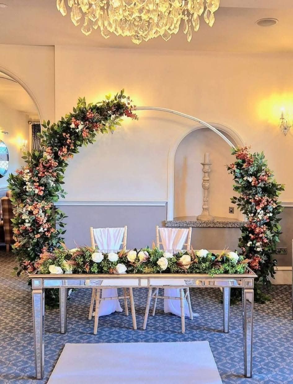 Large foliage moongate arch with white and blush pink roses