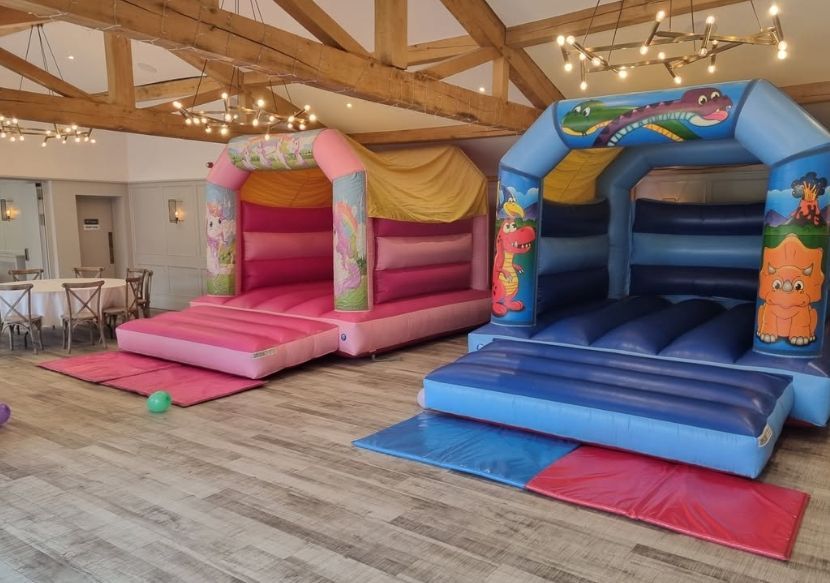 Pink and blue bouncy castles