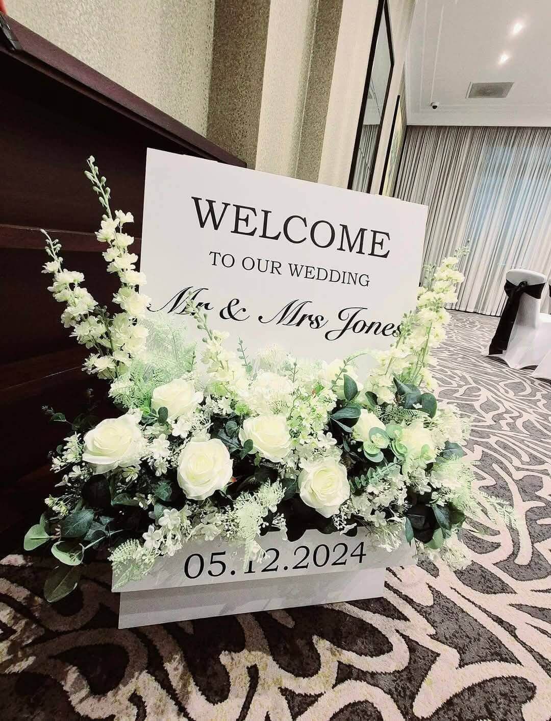 Personalised wedding welcome sign with flowers