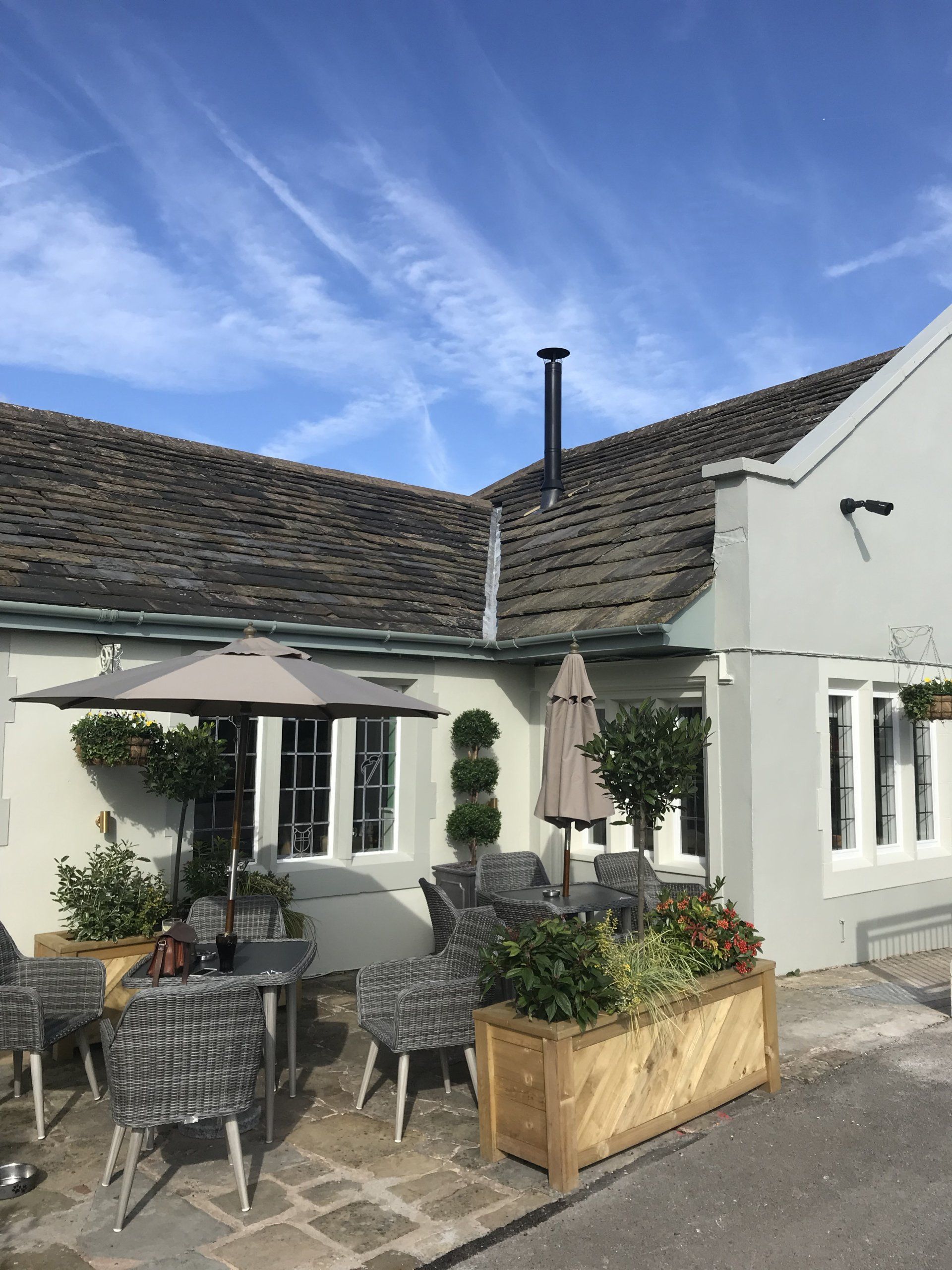 Twinwall flue installation with cowl and flashing kit through a roof