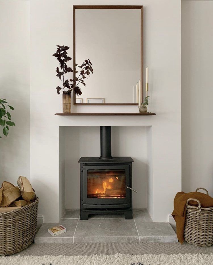 Tiled hearth with a fire boarded chamber and a Dunsley avance eco ready multifuel stove