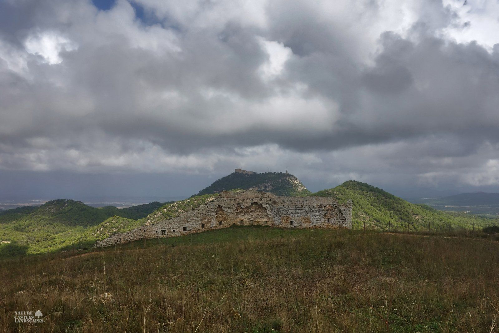 Castell de Santueri clouds and ruin
