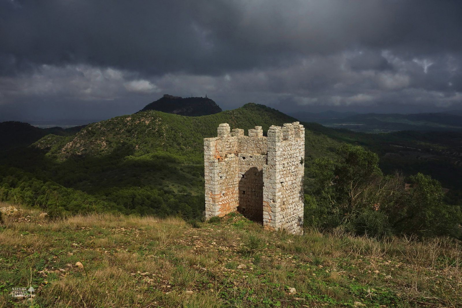 Castell de Santueri ruin and stormclouds