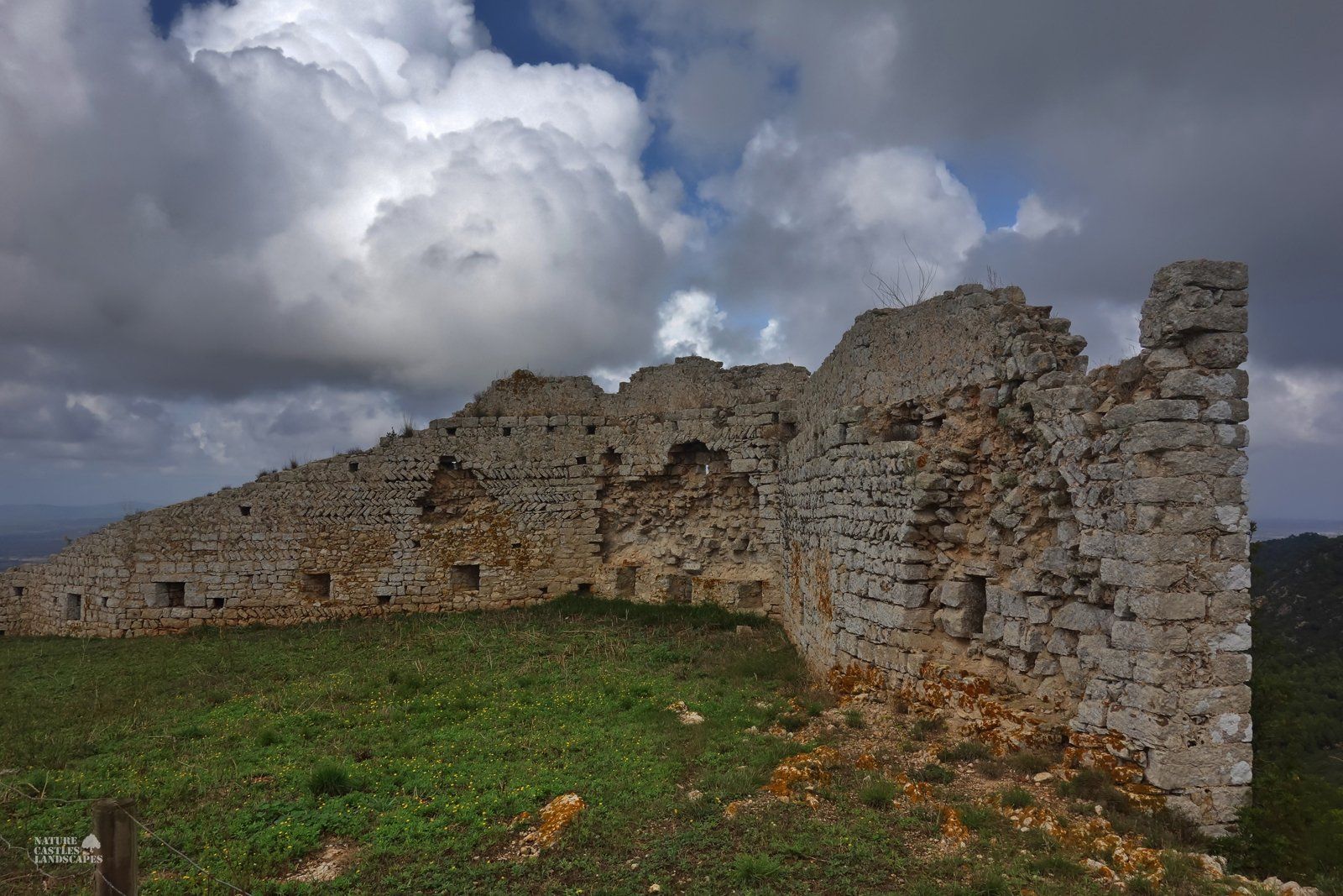 Castell de Santueri ancient wall and blue sky