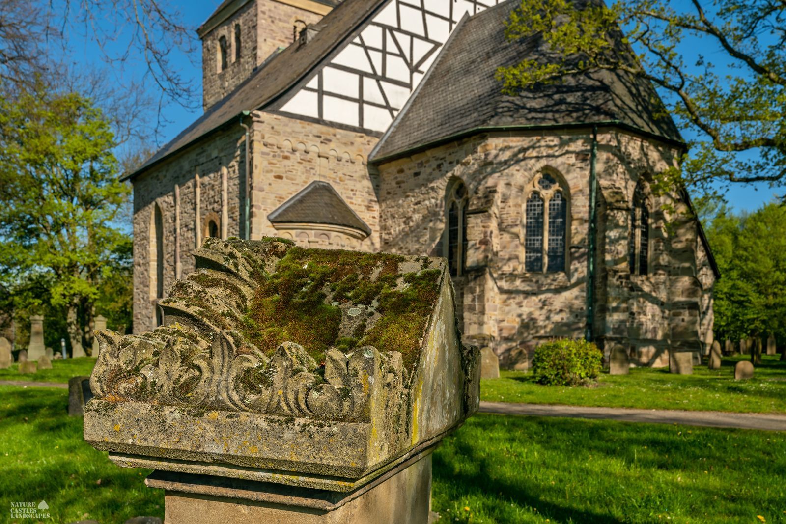 old gravestone in front of stiepel church