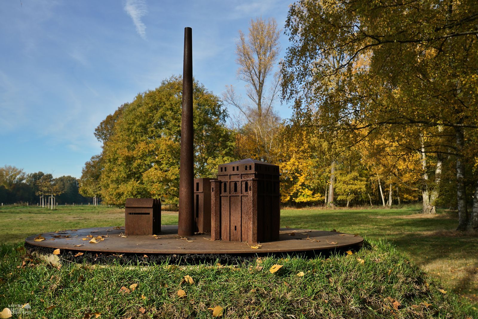 rusty metal model of a colliery at autumntime