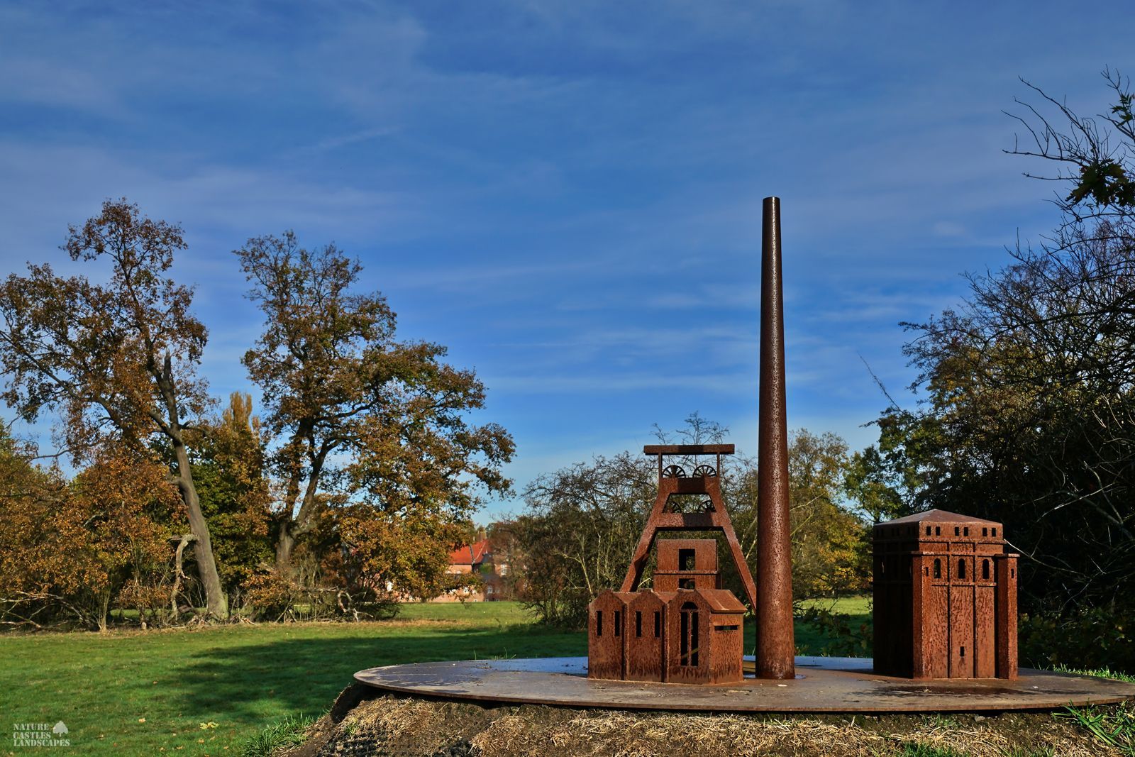 metal modelss of a colliery in front of castle herten