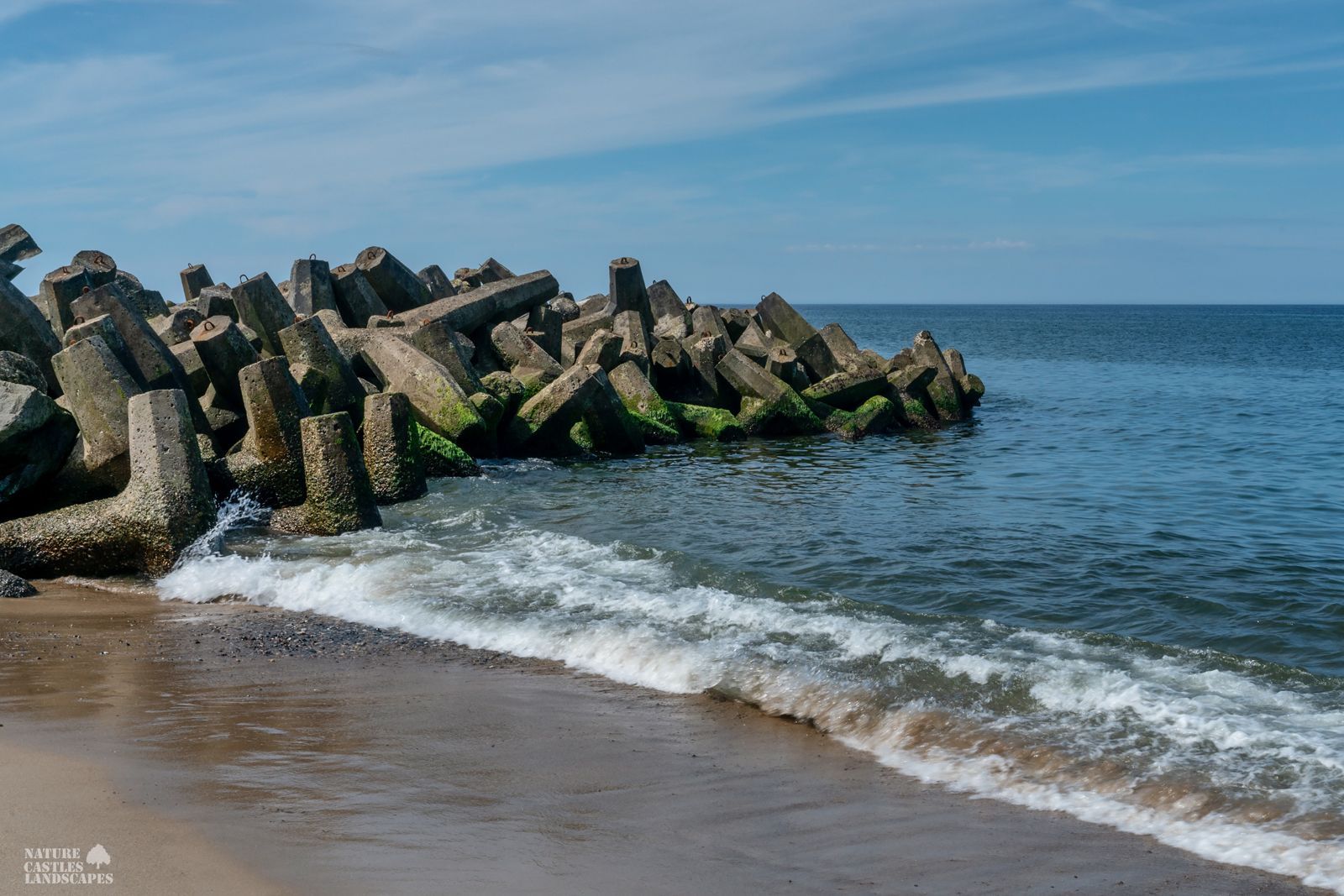 Danish North Sea coast breakwater in calm North Sea