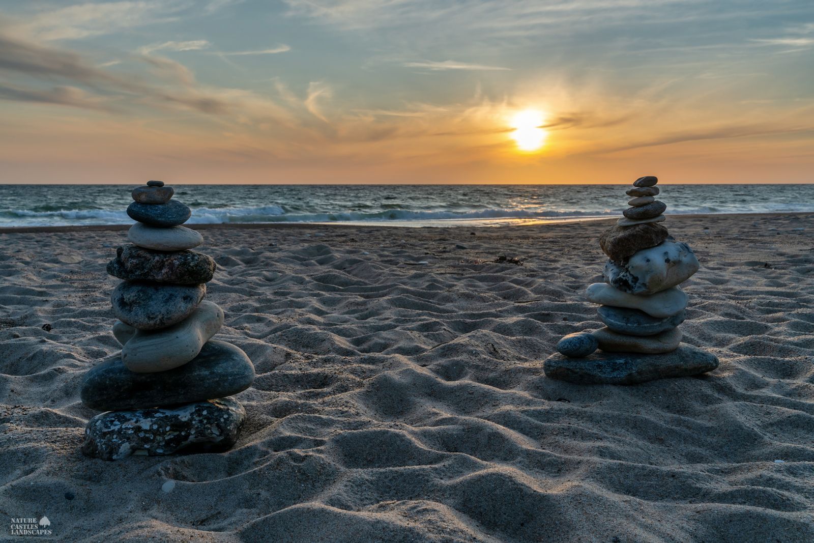 Danish North Sea coast rock balancing at sundown