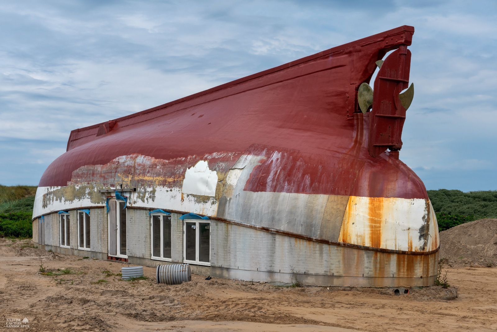 Construction work on an upturned fishing boat on the grounds of the Sea War Museum Jutland.