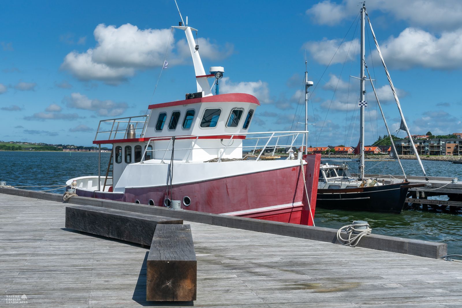 a very small boat in a harbor on the Danish North Sea coast