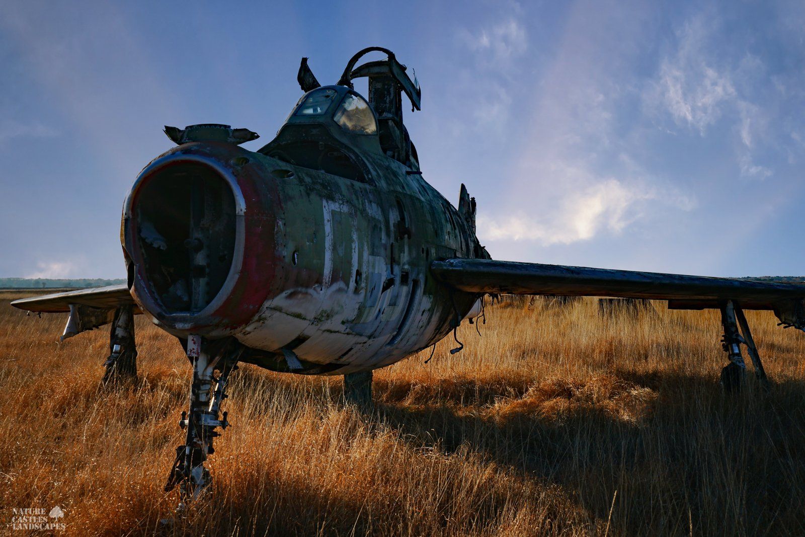 rusty jet F-84 at the military training area at dusk