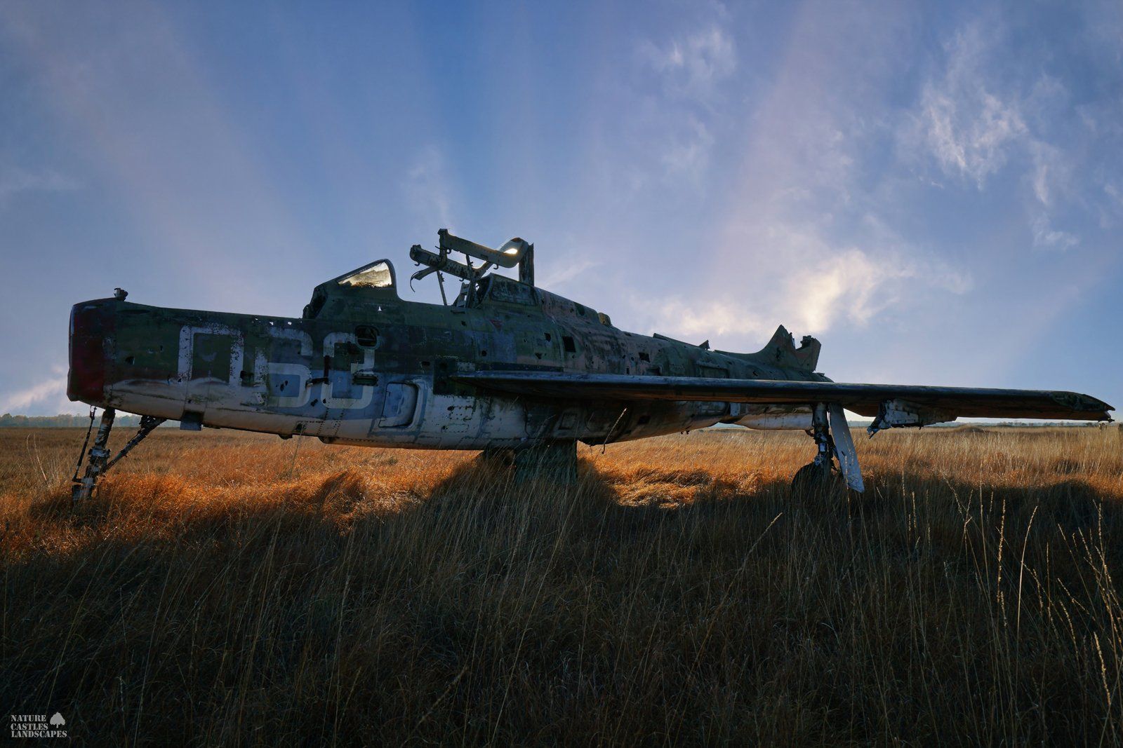 abandoned jet F-84 at the military training area at dusk