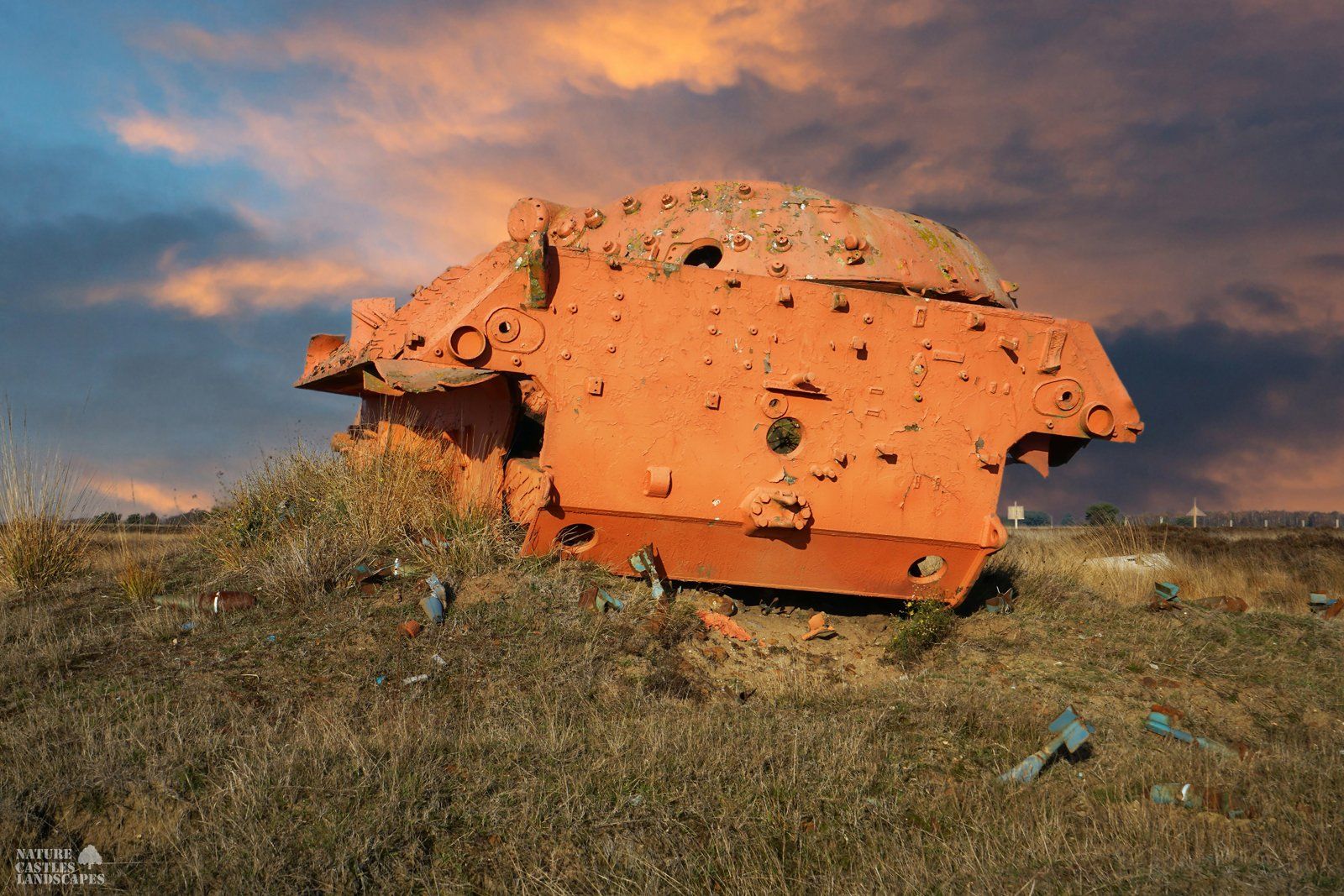leopard tank wreck at dusk