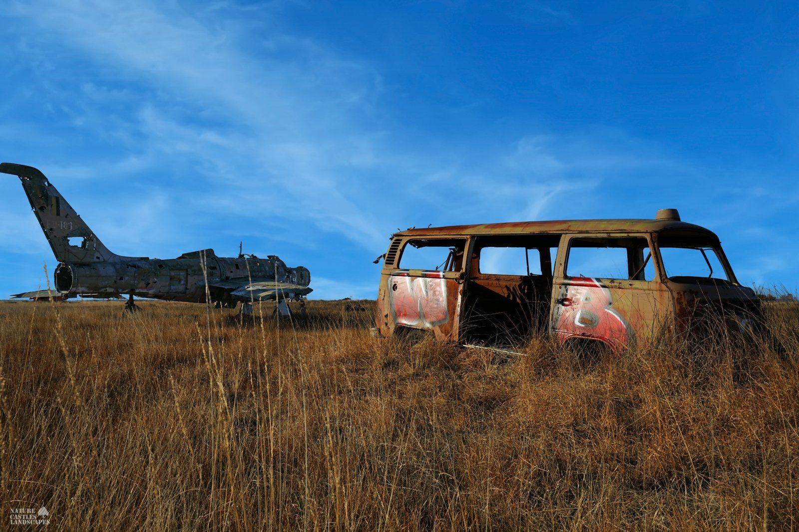 rusty car and a jet plane