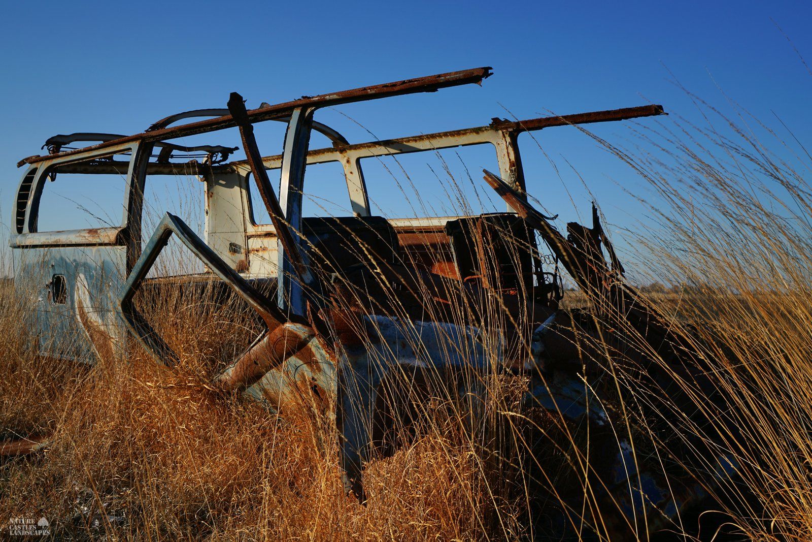 very rusty car in the heathland