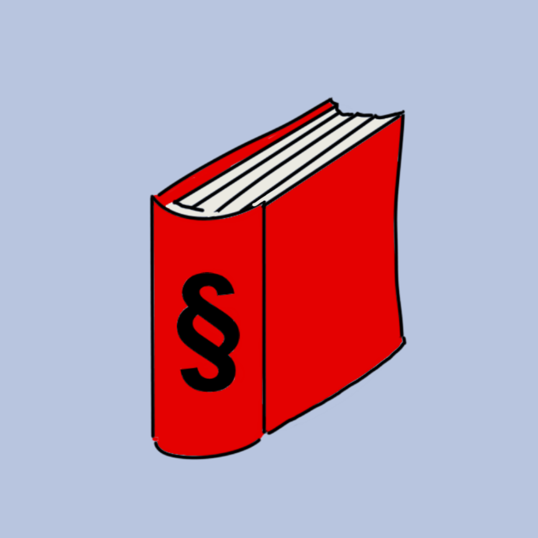 Ein geschlossenes rotes Buch mit einem schwarzen Paragraphenzeichen auf dem Einband.