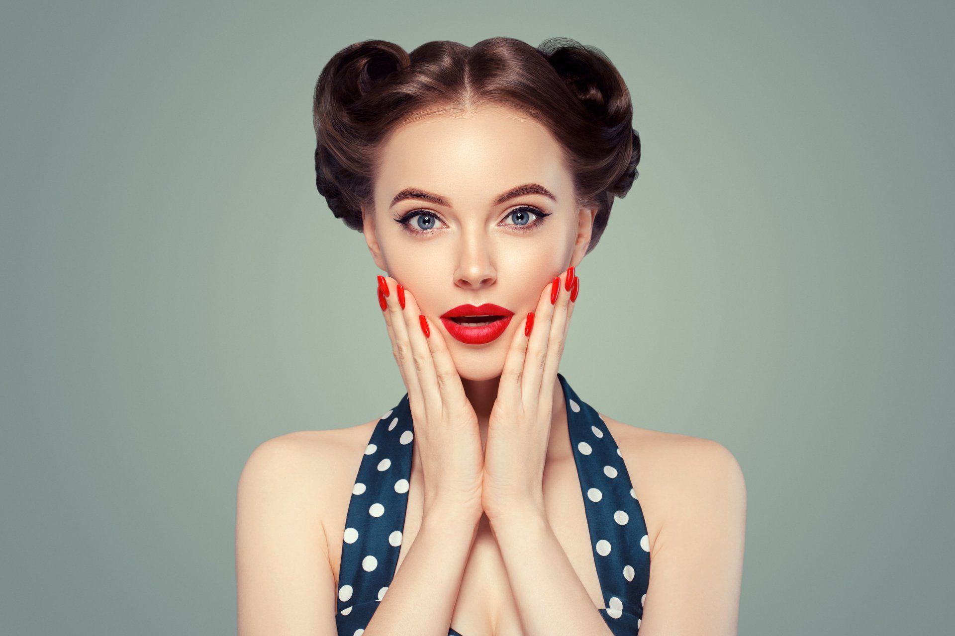 Pin up girl with hands on cheeks, looking surprised