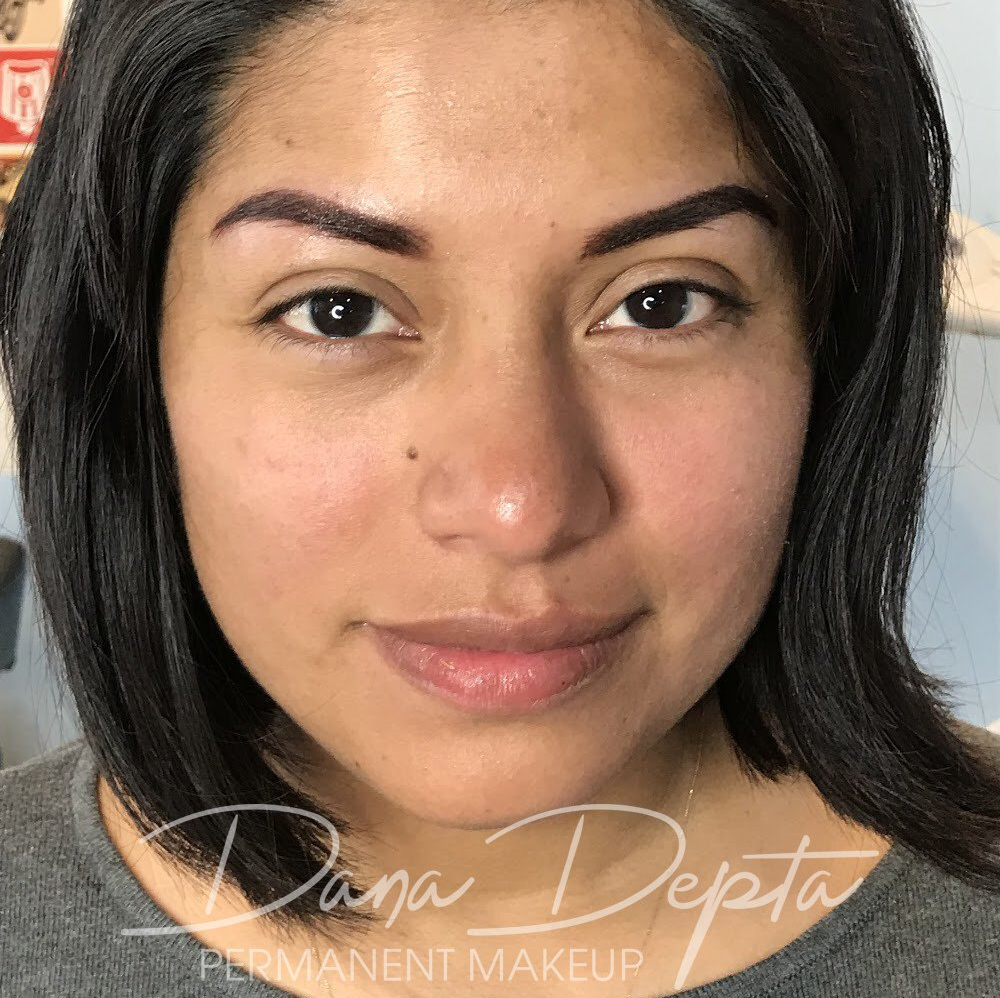 Beautiful powder brows on South American woman