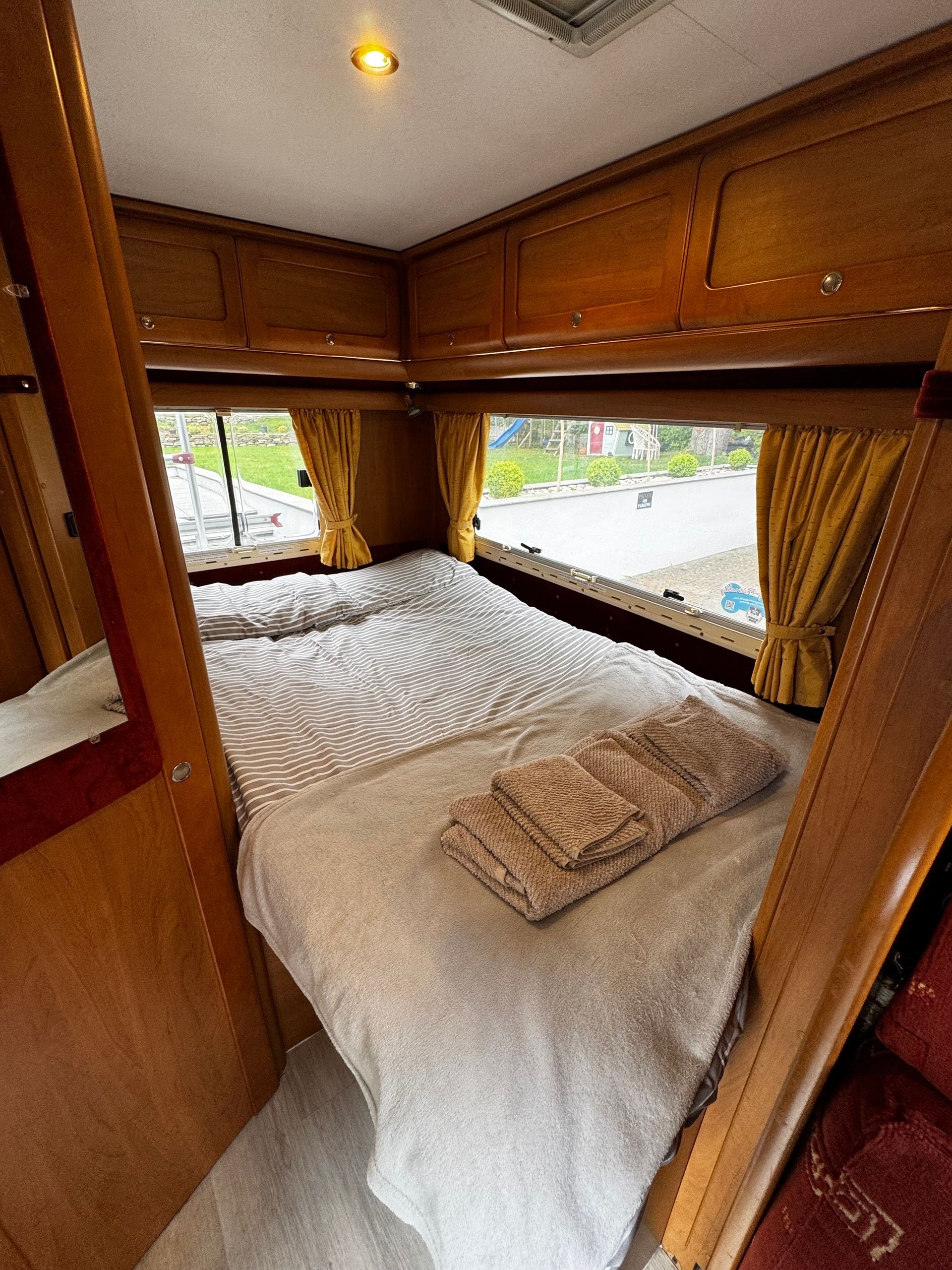 Comfy fixed double bed at rear.