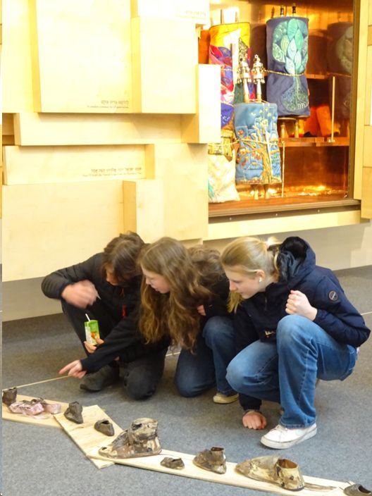Students with ceramic shoes