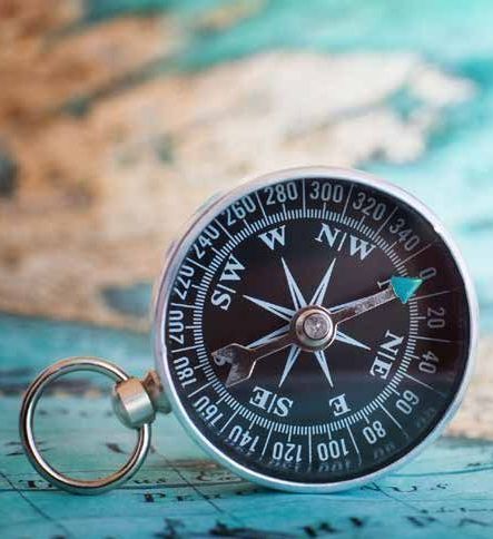 A picture of a map and compass