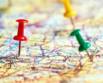 A picture of 3 pins of varying colours in a map