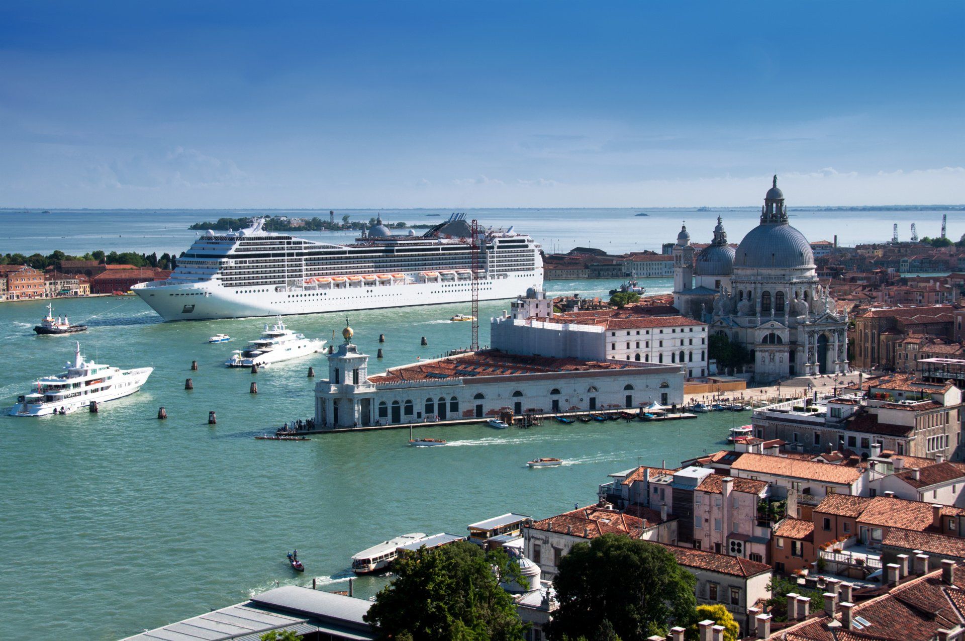A Cruise ship visiting Venice the city of romantic gondolas on the canals.