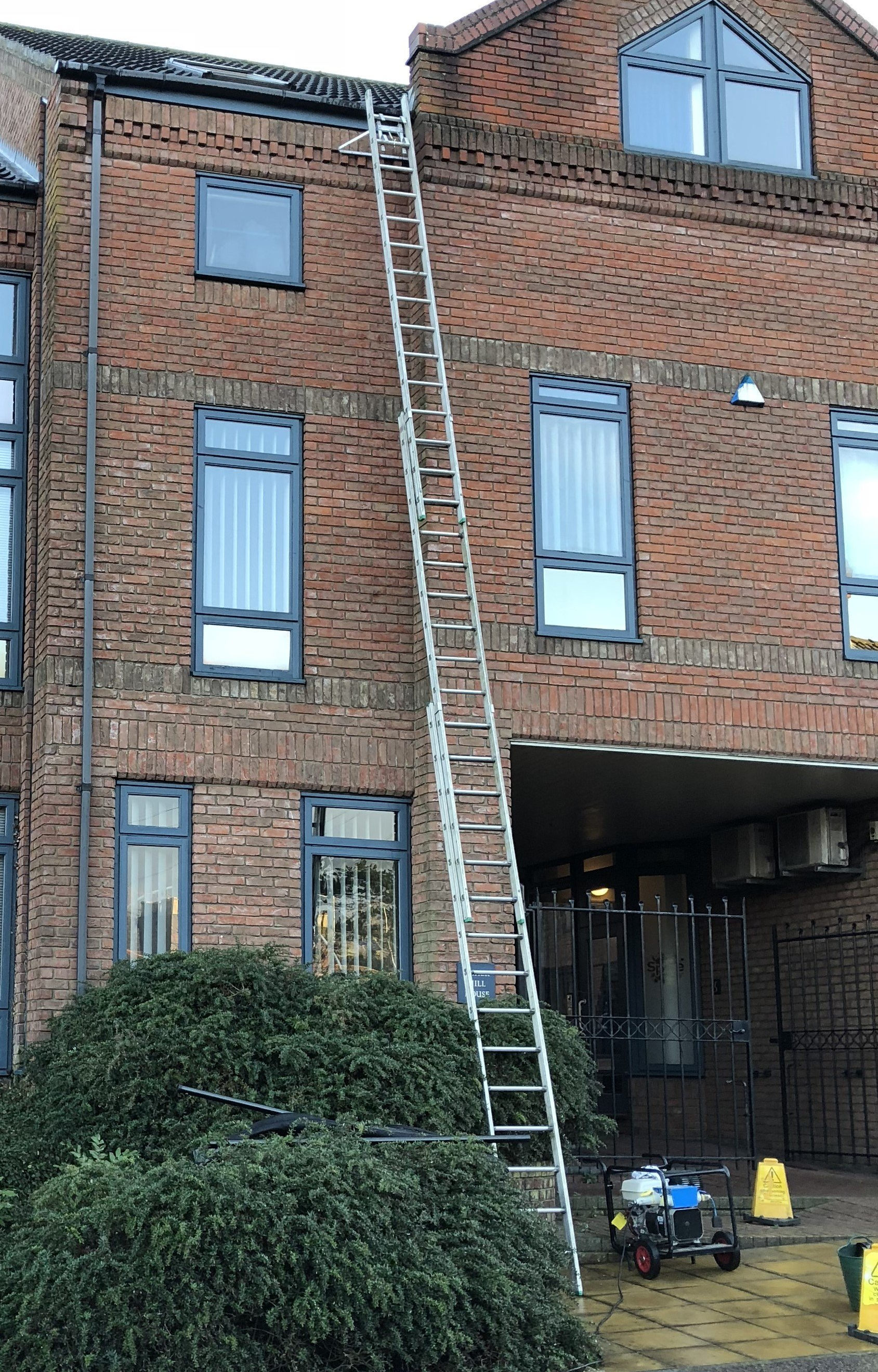 Gutter cleaning using a ladder