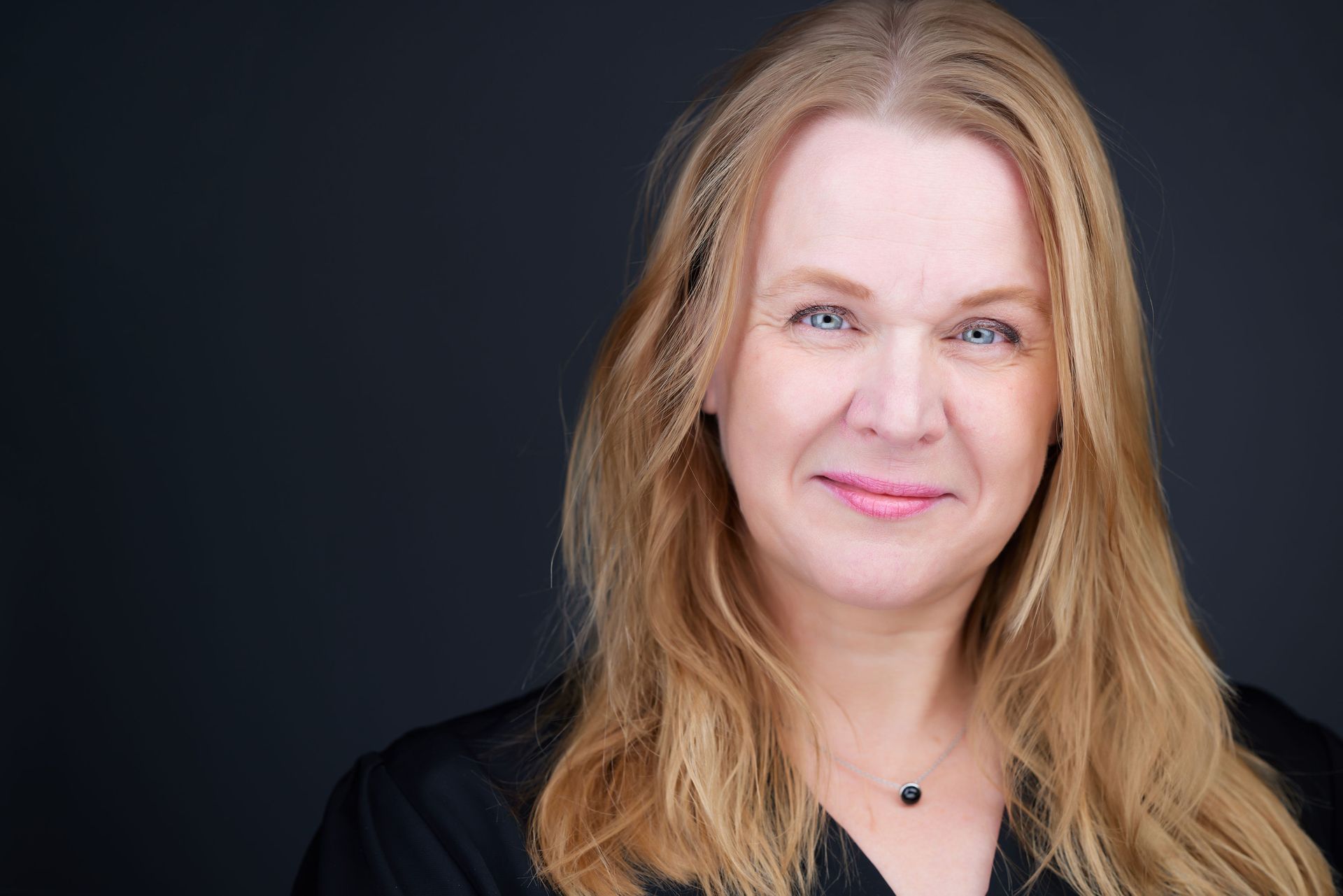 author Melanie Rook Welfing A woman with long hair.