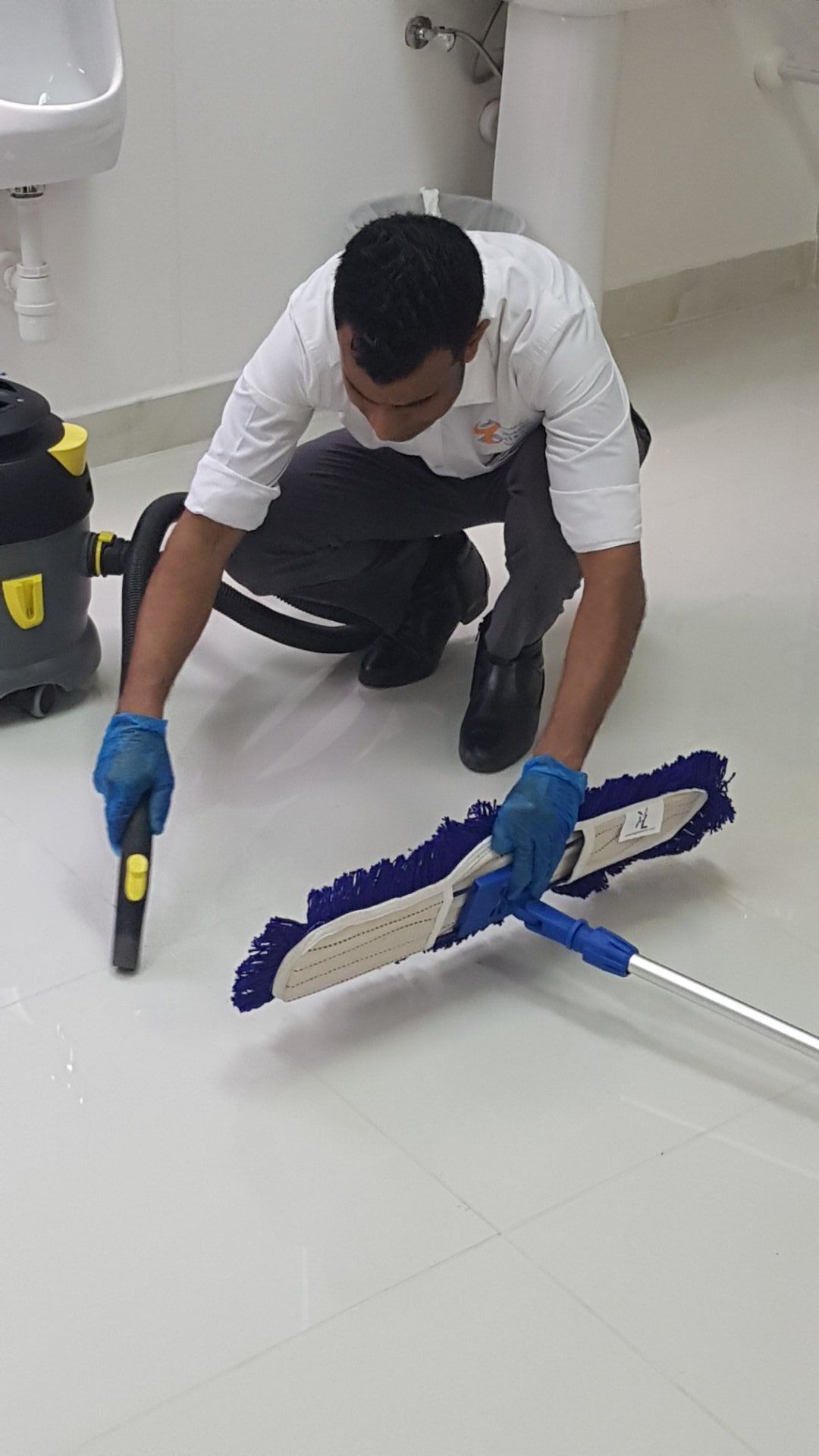 Person cleaning a floor